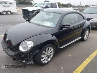 2017 Volkswagen Beetle 1.8T SE with VIN 3VWJ17AT9HM618202, listed as a IAAI auction lot 41562078 with 101,808 mi miles. Bid and sale history available at carsss.com. Image 2.