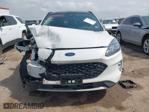 2020 Ford Escape Titanium Hybrid with VIN 1FMCU0DZ9LUA54867, listed as a IAAI auction lot 42268245 with 68,974 mi miles and . Bid and sale history available at DreamBid. Image 12.