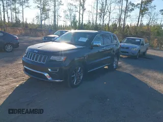 2014 Jeep Grand Cherokee Summit with VIN 1C4RJEJG1EC130727, listed as a IAAI auction lot 41269066 with 205,914 mi miles and . Bid and sale history available at DreamBid. Image 17.