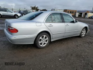2002 Mercedes-Benz E-Class with VIN WDBJF65J22B464517, listed as a Copart auction lot 82488204 with 217,069 mi miles and Salvage Title. Bid and sale history available at carsss.com. Image 3.