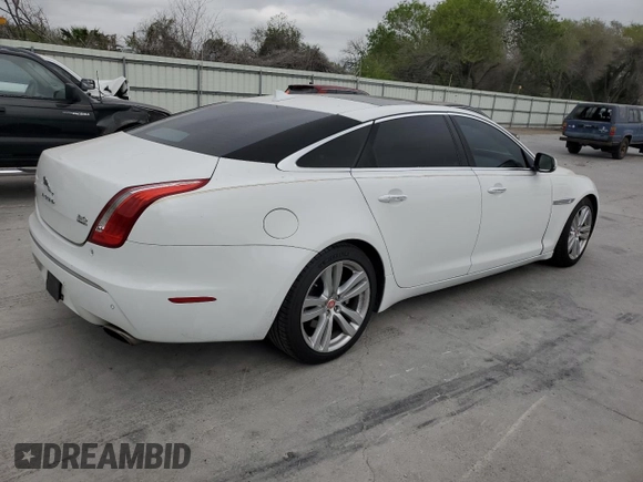 2014 Jaguar XJ Portfolio with VIN SAJWJ2GD6E8V65987, listed as a Copart auction lot 50091105 with 136,080 mi miles and Clean title. Bid and sale history available at DreamBid. Image 3.