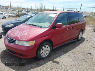 2003 Honda Odyssey EX-L with VIN 5FNRL189X3B135872, listed as a IAAI auction lot 42035948 with Not Provided miles and . Bid and sale history available at DreamBid. Image 2.