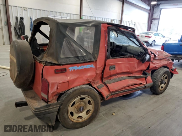 1994 Geo Tracker z VIN 2CNBE18U3R6952403, wystawiony jako Copart lot #79038524 z przebiegiem 271 461 mil mil oraz Szkody całkowita. Historia ofert i sprzedaży dostępna na DreamBid. Obrazek 3.