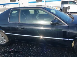 1999 Cadillac Eldorado Touring z VIN 1G6ET129XXU603042, wystawiony jako IAAI lot #41699955 z przebiegiem 81 704 mil mil oraz . Historia ofert i sprzedaży dostępna na DreamBid. Obrazek 14.