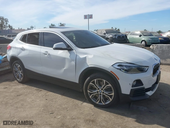 2020 BMW X2 sDrive28i with VIN WBXYH9C01L5P15004, listed as a IAAI auction lot 41128060 with 86,052 mi miles. Bid and sale history available at carsss.com. Image 1.