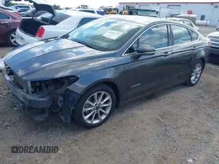 2017 Ford Fusion Hybrid SE z VIN 3FA6P0LU3HR260558, wystawiony jako IAAI lot #42657176 z przebiegiem 161 183 mil mil oraz . Historia ofert i sprzedaży dostępna na DreamBid. Obrazek 2.