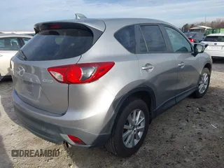 2015 Mazda CX-5 Touring with VIN JM3KE2CYXF0435583, listed as a IAAI auction lot 41737810 with 107,270 mi miles and . Bid and sale history available at DreamBid. Image 4.