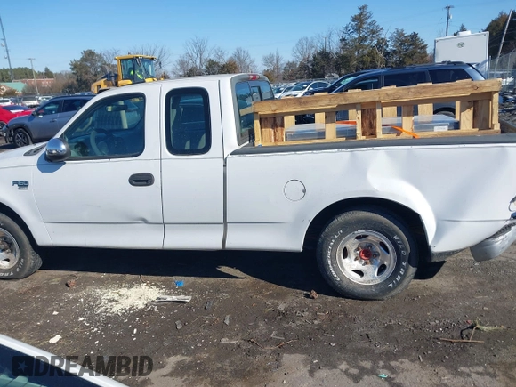 2000 Ford F-150 z VIN 2FTPX17L7YCA51774, wystawiony jako IAAI lot #41426958 z przebiegiem 421 412 mil mil oraz . Historia ofert i sprzedaży dostępna na DreamBid. Obrazek 14.