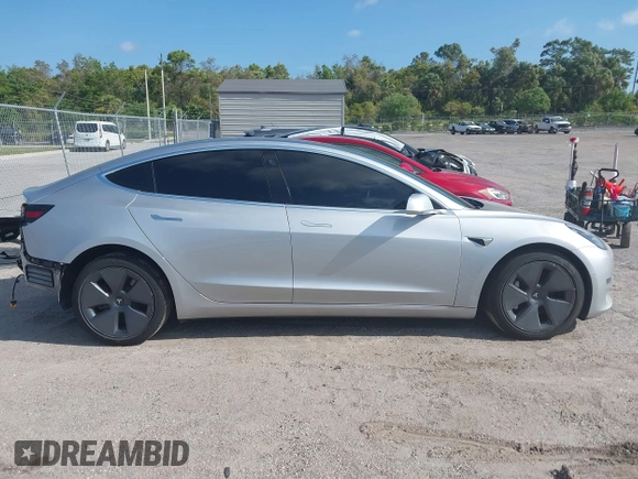 2018 Tesla Model 3 Long Range Battery with VIN 5YJ3E1EB7JF104356, listed as a IAAI auction lot 41936961 with 90,932 mi miles and . Bid and sale history available at DreamBid. Image 14.