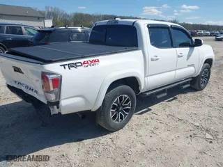 2023 Toyota Tacoma 4WD SR with VIN 3TMCZ5AN8PM647523, listed as a IAAI auction lot 41887896 with 17,864 mi miles. Bid and sale history available at carsss.com. Image 4.