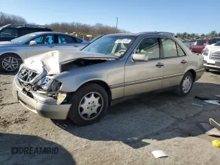 1996 Mercedes-Benz C with VIN WDBHA28E7TF319617, listed as a Copart auction lot 80874744 with 92,068 mi miles and Salvage Title. Bid and sale history available at carsss.com. Image 1.