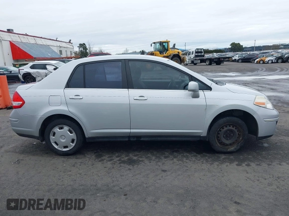2007 Nissan Versa 1.8 SL with VIN 3N1BC11E97L447829, listed as a IAAI auction lot 41612386 with 123,500 mi miles. Bid and sale history available at carsss.com. Image 13.