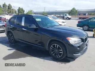 2015 BMW X1 sDrive28i with VIN WBAVM1C59FVW57928, listed as a IAAI auction lot 42056452 with 115,411 mi miles. Bid and sale history available at carsss.com. Image 1.