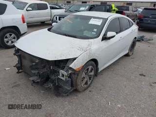 2020 Honda Civic LX with VIN 19XFC2F62LE021811, listed as a IAAI auction lot 41591466 with 75,797 mi miles and . Bid and sale history available at DreamBid. Image 2.