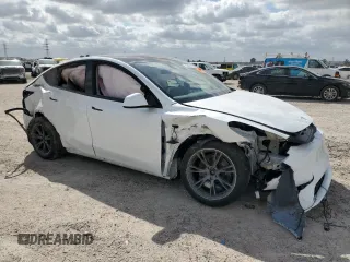 2024 Tesla Model Y Long Range with VIN 7SAYGDEE2RA335818, listed as a Copart auction lot 48821475 with 4,415 mi miles and Salvage Title. Bid and sale history available at DreamBid. Image 4.
