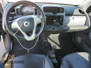 2009 Smart fortwo Pure z VIN WMEEJ31X49K253051, wystawiony jako Copart lot #70193934 z przebiegiem Nie podano mil oraz Szkody całkowita. Historia ofert i sprzedaży dostępna na DreamBid. Obrazek 8.