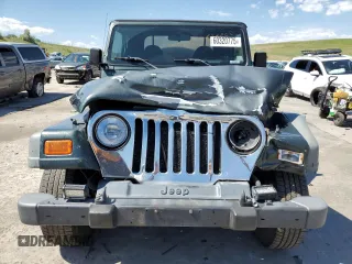 2002 Jeep Wrangler Sport с VIN 1J4FA49SX2P738105, выставлен на аукционе Copart как лот 60320775 с пробегом 402 518 миль миль и Списание • Salvage title. История ставок и продаж доступна на DreamBid. Изображение 5.
