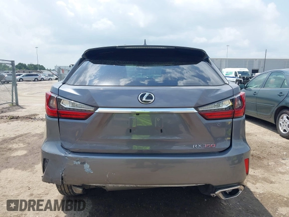 2016 Lexus RX 350 z VIN 2T2ZZMCAXGC031079, wystawiony jako IAAI lot #42120190 z przebiegiem 142 407 mil mil oraz . Historia ofert i sprzedaży dostępna na DreamBid. Obrazek 16.