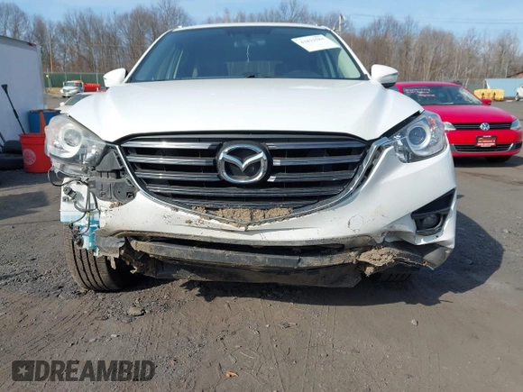 2016 Mazda CX-5 Grand Touring with VIN JM3KE4DYXG0836692, listed as a IAAI auction lot 41812584 with 119,302 mi miles. Bid and sale history available at carsss.com. Image 6.