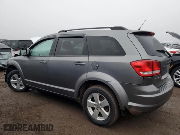 2013 Dodge Journey American Value with VIN 3C4PDCABXDT578099, listed as a Copart auction lot 48867795 with 187,338 mi miles and Salvage title. Bid and sale history available at DreamBid. Image 2.