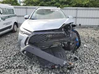 2023 Toyota Corolla Cross XLE with VIN 7MUDAABG6PV078570, listed as a Copart auction lot 65246535 with 21,928 mi miles and Salvage title. Bid and sale history available at DreamBid. Image 5.