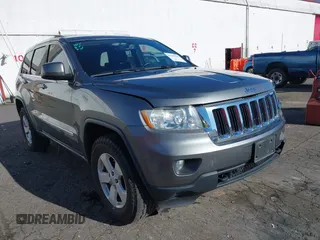 2011 Jeep Grand Cherokee Laredo with VIN 1J4RR4GG9BC714325, listed as a IAAI auction lot 41560915 with 153,372 mi miles. Bid and sale history available at carsss.com. Image 1.
