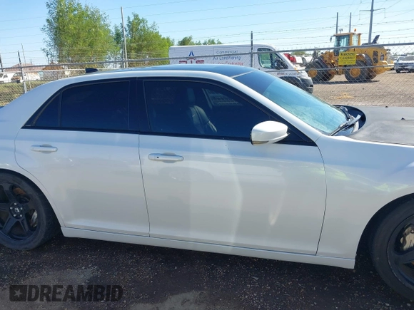 2012 Chrysler 300 SRT-8 with VIN 2C3CCAFJ9CH801749, listed as a IAAI auction lot 40912606 with 144,404 mi miles and . Bid and sale history available at DreamBid. Image 14.