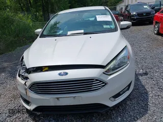 2016 Ford Focus Titanium with VIN 1FADP3N26GL332709, listed as a IAAI auction lot 42458997 with 75,509 mi miles and . Bid and sale history available at DreamBid. Image 12.