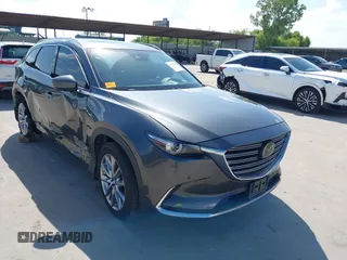 2019 Mazda CX-9 Grand Touring with VIN JM3TCADY8K0325533, listed as a IAAI auction lot 42728850 with 96,418 mi miles and . Bid and sale history available at DreamBid. Image 1.