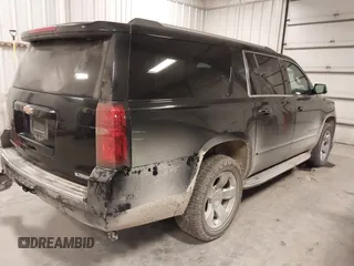 2017 Chevrolet Suburban Premier z VIN 1GNSKJKC0HR250854, wystawiony jako IAAI lot #41541476 z przebiegiem 128 231 mil mil oraz . Historia ofert i sprzedaży dostępna na DreamBid. Obrazek 4.