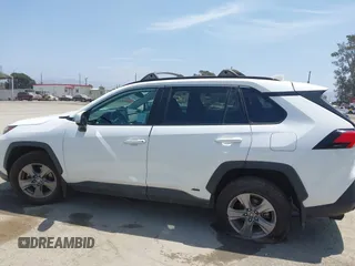 2022 Toyota RAV4 Hybrid XLE with VIN 2T3RWRFV9NW130472, listed as a IAAI auction lot 40990707 with 156,174 mi miles and . Bid and sale history available at DreamBid. Image 14.