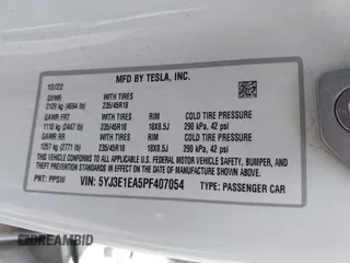 2023 Tesla Model 3 with VIN 5YJ3E1EA5PF407054, listed as a IAAI auction lot 42313770 with 57,621 mi miles and . Bid and sale history available at DreamBid. Image 9.