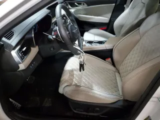 2023 Genesis G70 3.3T with VIN KMTG54TE3PU134147, listed as a Copart auction lot 61597955 with 9,863 mi miles and Salvage title. Bid and sale history available at DreamBid. Image 7.