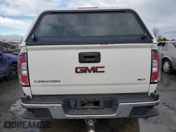 2016 GMC Canyon 4WD SLT with VIN 1GTP6DE11G1266217, listed as a Copart auction lot 82195694 with 129,578 mi miles and Clean Title. Bid and sale history available at carsss.com. Image 6.