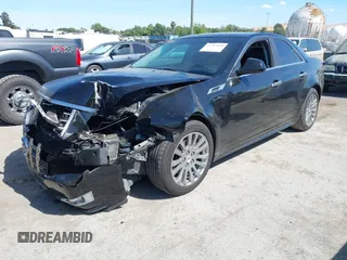 2012 Cadillac CTS Performance z VIN 1G6DJ5E30C0156576, wystawiony jako IAAI lot #42287858 z przebiegiem 106 497 mil mil oraz . Historia ofert i sprzedaży dostępna na DreamBid. Obrazek 2.