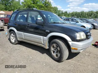 1999 Suzuki Grand Vitara z VIN JS3TD62VXX4100236, wystawiony jako Copart lot #57228075 z przebiegiem Nie podano mil oraz Szkody całkowita. Historia ofert i sprzedaży dostępna na DreamBid. Obrazek 4.