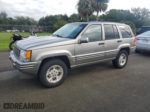 1998 Jeep Grand Cherokee Limited with VIN 1J4GZ78S2WC222768, listed as a Copart auction lot 73942154 with Not provided miles and Salvage title. Bid and sale history available at DreamBid. Image 1.