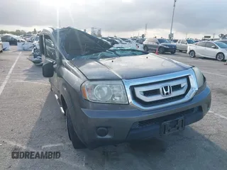 2011 Honda Pilot LX z VIN 5FNYF3H24BB010432, wystawiony jako IAAI lot #41870086 z przebiegiem Nie podano mil oraz . Historia ofert i sprzedaży dostępna na DreamBid. Obrazek 1.