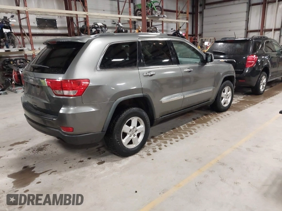 2011 Jeep Grand Cherokee Laredo with VIN 1J4RR4GG3BC623048, listed as a IAAI auction lot 42163452 with 192,241 mi miles and . Bid and sale history available at DreamBid. Image 4.