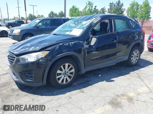 2016 Mazda CX-5 Sport with VIN JM3KE2BY4G0807776, listed as a IAAI auction lot 42206641 with 136,809 mi miles and . Bid and sale history available at DreamBid. Image 2.