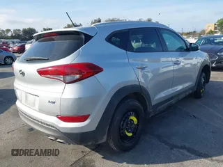 2016 Hyundai Tucson Sport with VIN KM8J33A20GU165154, listed as a IAAI auction lot 41611785 with Not Provided miles. Bid and sale history available at carsss.com. Image 4.
