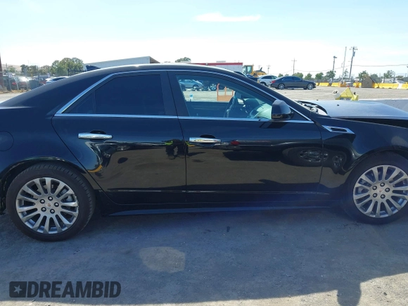 2012 Cadillac CTS Performance z VIN 1G6DJ5E30C0156576, wystawiony jako IAAI lot #42287858 z przebiegiem 106 497 mil mil oraz . Historia ofert i sprzedaży dostępna na DreamBid. Obrazek 14.
