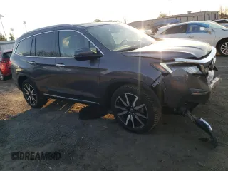 2020 Honda Pilot Touring 8-Passenger with VIN 5FNYF6H92LB031005, listed as a Copart auction lot 49545335 with 59,789 mi miles and Salvage Title. Bid and sale history available at DreamBid. Image 4.