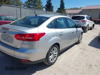 2017 Ford Focus SE z VIN 1FADP3F21HL237412, wystawiony jako IAAI lot #42188886 z przebiegiem 148 355 mil mil oraz . Historia ofert i sprzedaży dostępna na DreamBid. Obrazek 4.