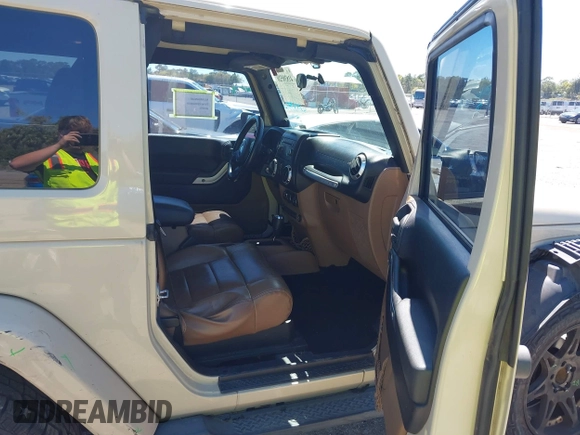 2011 Jeep Wrangler Sahara with VIN 1J4AA5D13BL562732, listed as a IAAI auction lot 41838520 with 148,359 mi miles and . Bid and sale history available at DreamBid. Image 5.