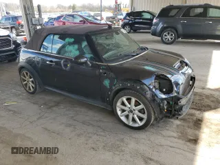 2014 MINI Convertible S with VIN WMWZP3C55ET706573, listed as a Copart auction lot 52325705 with 125,076 mi miles and Salvage Title. Bid and sale history available at DreamBid. Image 4.