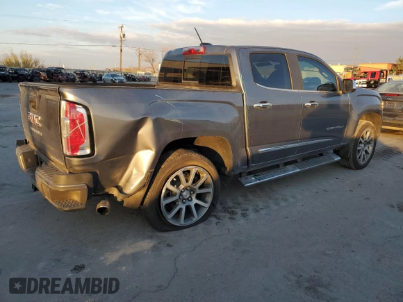 2021 GMC Canyon 4WD Denali with VIN 1GTG6EEN4M1130779, listed as a Copart auction lot 82695044 with 38,662 mi miles and Salvage Title. Bid and sale history available at carsss.com. Image 3.