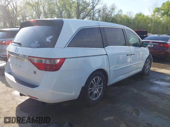 2012 Honda Odyssey EX-L with VIN 5FNRL5H62CB010054, listed as a IAAI auction lot 42040117 with 189,566 mi miles and . Bid and sale history available at carsss.com. Image 4.