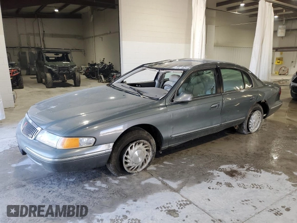 1997 Lincoln Continental with VIN 1LNLM97VXVY624609, listed as a Copart auction lot 73921634 with 119,746 mi miles and Salvage Title. Bid and sale history available at carsss.com. Image 1.