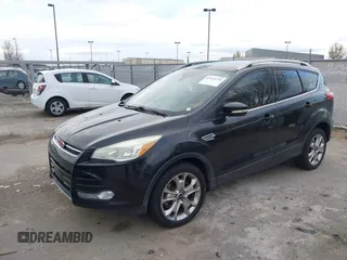 2015 Ford Escape Titanium with VIN 1FMCU9J96FUA27221, listed as a IAAI auction lot 41925276 with 180,758 mi miles and . Bid and sale history available at carsss.com. Image 2.